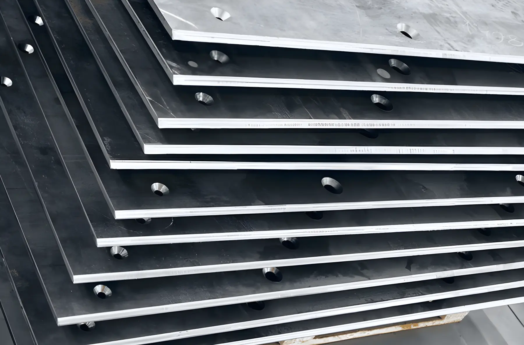 Sheet metal part with countersunk holes for flat head screws